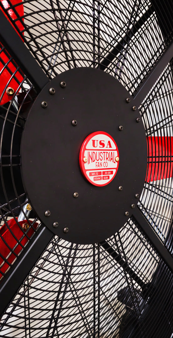 Close up of a metal frame for a 72" Floor Fan with black motor housing, red blades and red and white branded badge, product of Industrial Fan Co