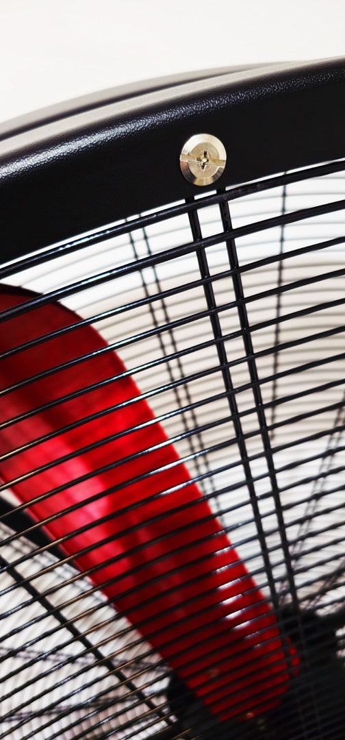 Close up of a metal frame for a 72" Floor Fan with black plastic guard, red blade and silver hardware, product of Industrial Fan Co
