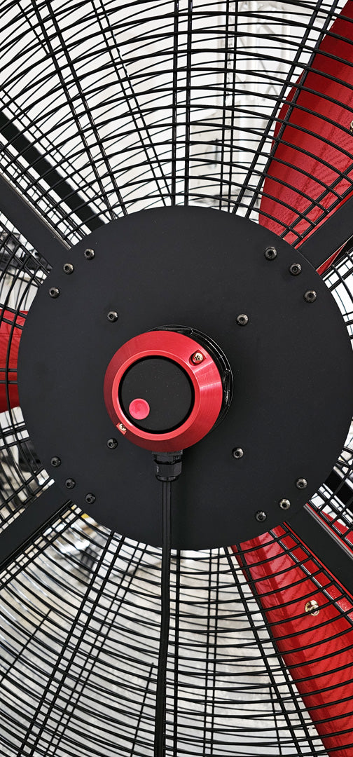 Close up of a variable speed controller for a 72" Floor Fan with black housing, red  frame, 3 red blades, product of Industrial Fan Co