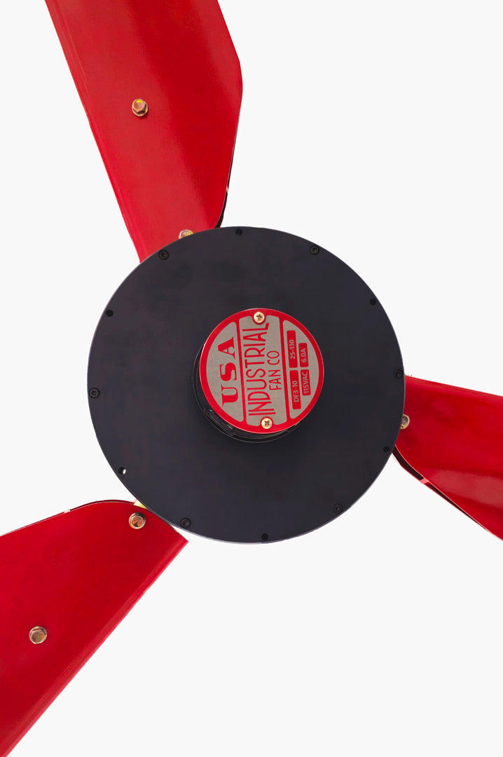 Close up of a motor casing, red and silver brand badge and 3 red blades for DF3 Red Industrial Ceiling Fan, product of Industrial Fan Co, on a white background