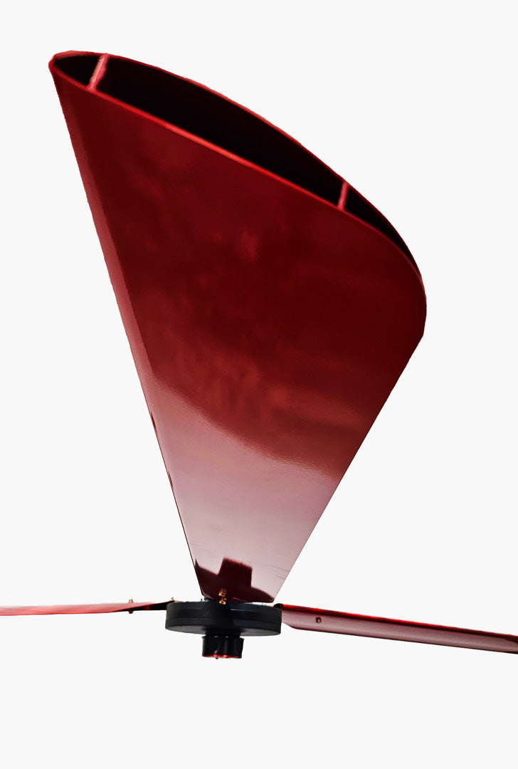 Close up of a one of the red blades, with motor and red brand badge in a distance,   for DF3 Red Industrial Ceiling Fan, product of Industrial Fan Co