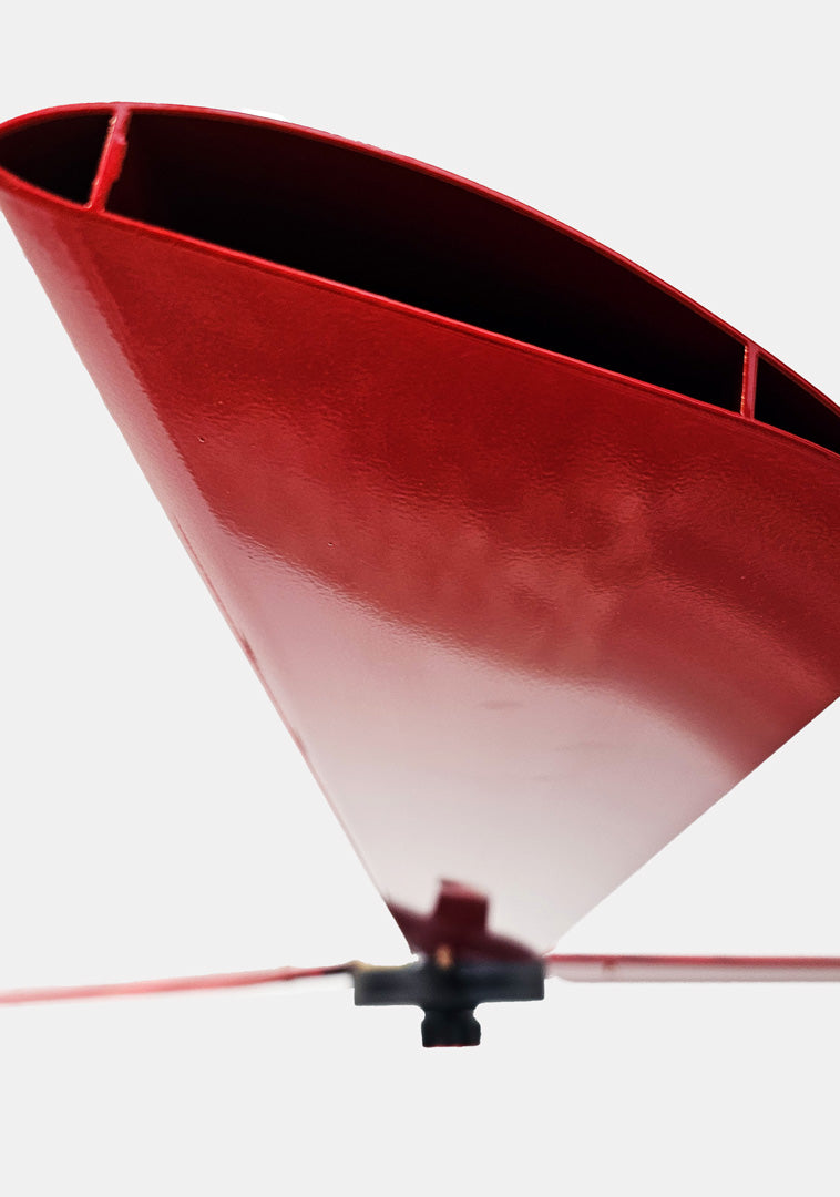 Close up of a one of the red blades, with motor and red brand badge in a distance,   for DF3 Red Industrial Ceiling Fan, product of Industrial Fan Co