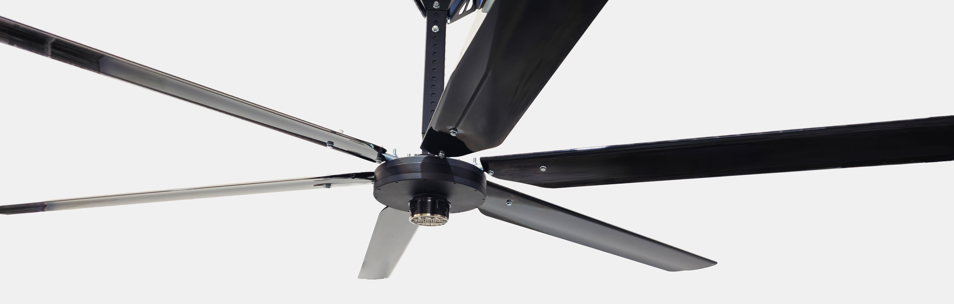 Close up of a telescoping mount, motor, silver brand badge and 6 blades for DF6 Black Industrial Ceiling Fan from Industrial Fan Co