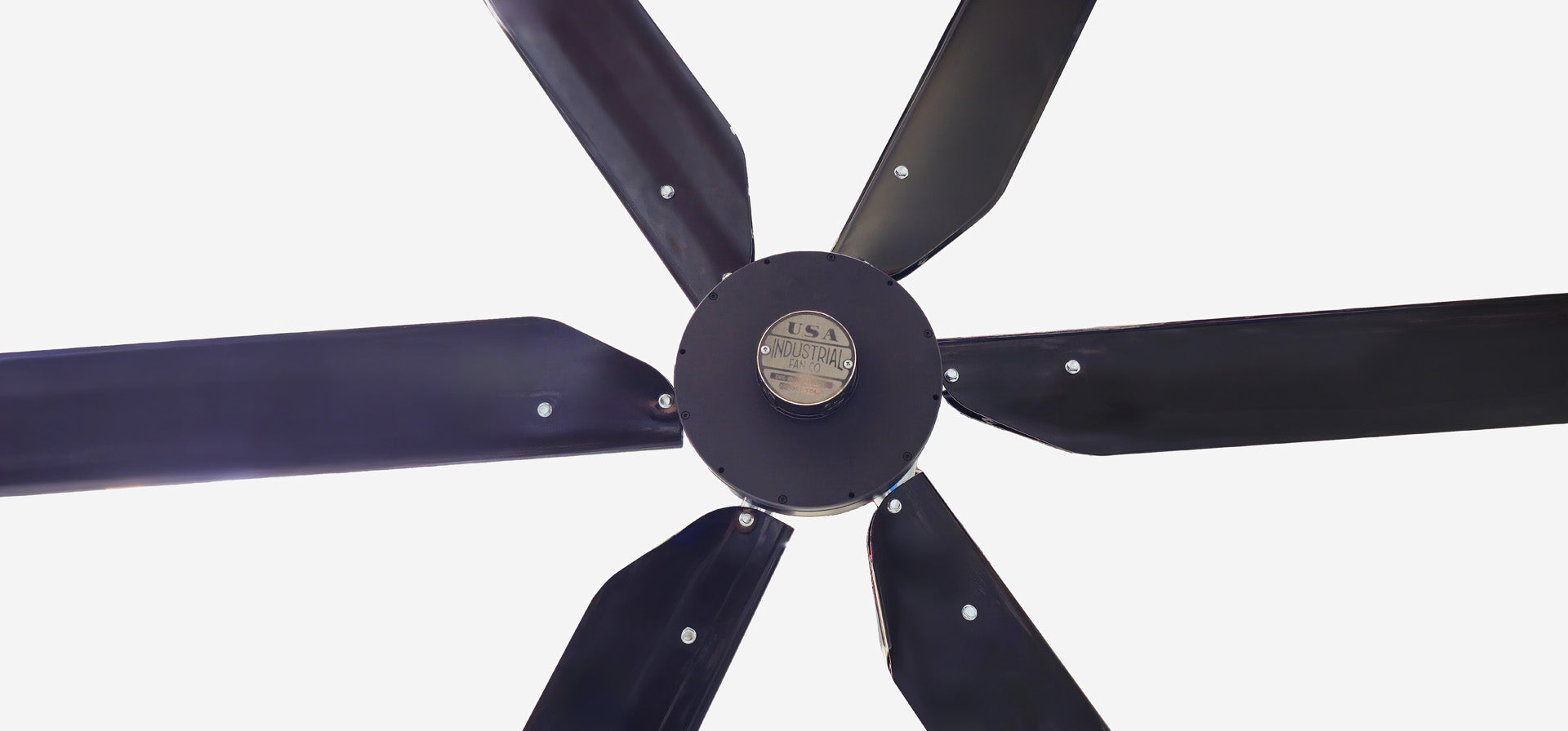 Close up of a motor, silver brand badge and 6 blades for DF6 Black Industrial Ceiling Fan from Industrial Fan Co