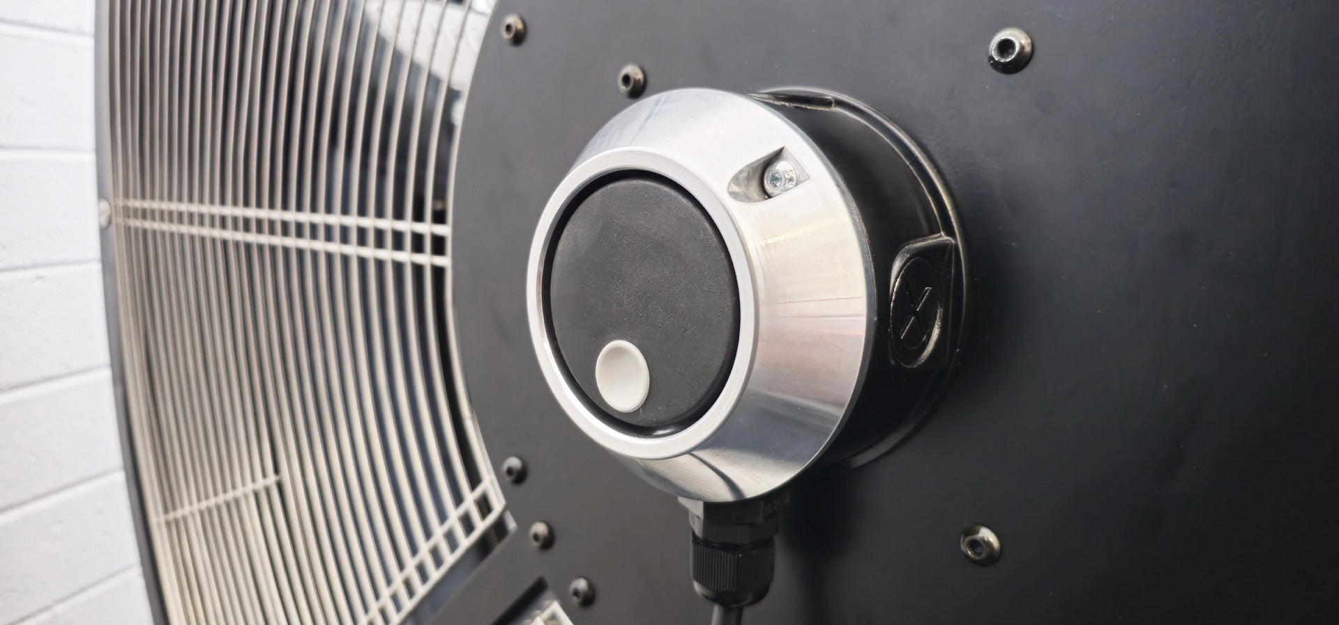 Close-up of a black and silver industrial floor fan blade and variable speed controller for 48" Floor Fan, product of Industrial Fan Co