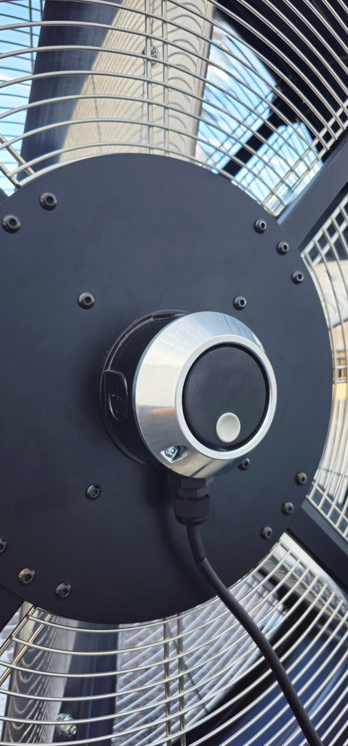 Close-up of a 48" industrial floor fan with a black motor housing and variable controller from Industrial Fan Co