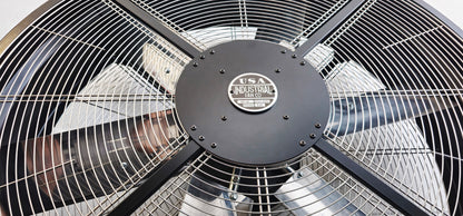 Close-up of a 48" industrial floor fan with silver blades and black housing on a white background with a visible brand logo, product of Industrial Fan Co large 