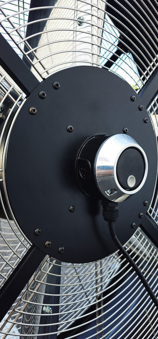 Close-up of a 48" industrial floor fan with a black motor housing and variable controller from Industrial Fan Co