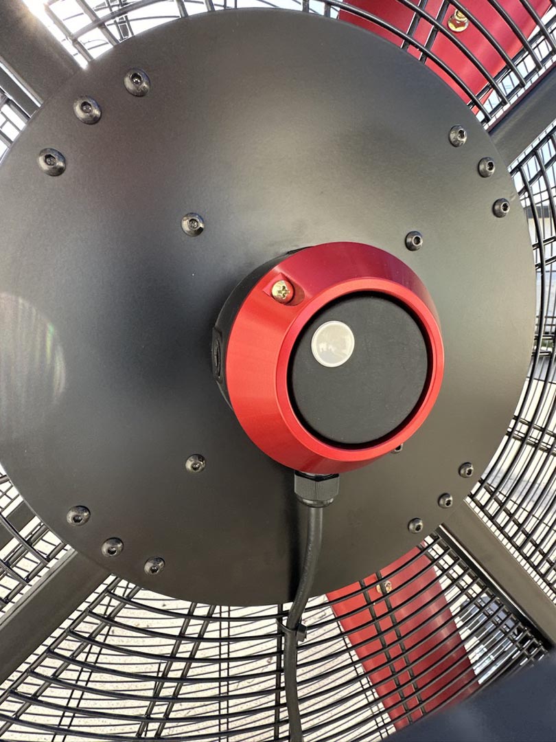 Close up of a variable speed controller for a 72" Floor Fan with black housing, red  frame, product of Industrial Fan Co